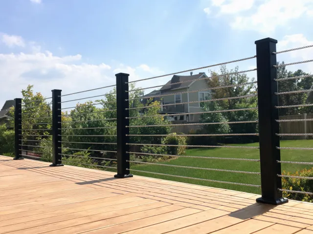Outdoor deck cable railing overlooking a backyard