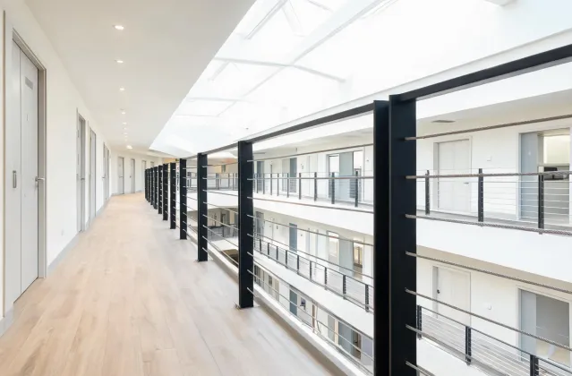 Multifamily corridor balcony with cable railing